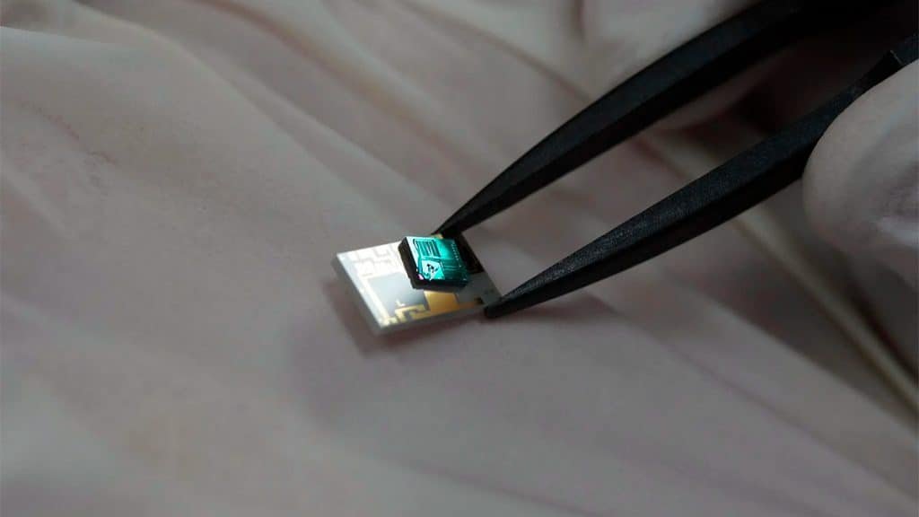 New processor being handled with tweezers